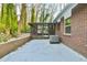 Screened porch and concrete patio with wooded views at 2836 Crescendo Dr, Atlanta, GA 30318