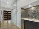 Bright entryway with glass wall and modern wet bar at 697 Kendall Ne St, Atlanta, GA 30312