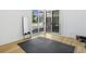 Bright home gym with wood floors, large mirror, and access to a rooftop deck at 697 Kendall Ne St, Atlanta, GA 30312