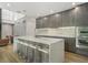 Open concept kitchen boasting modern appliances and breakfast bar at 697 Kendall Ne St, Atlanta, GA 30312