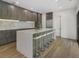 Modern kitchen with sleek cabinetry, island, and hardwood floors at 697 Kendall Ne St, Atlanta, GA 30312