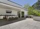 Modern rooftop entertainment area with an outdoor kitchen and hot tub at 697 Kendall Ne St, Atlanta, GA 30312