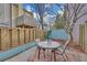Private backyard patio area with a table, chairs, and wooden fencing at 218 Forkner Dr # D, Decatur, GA 30030