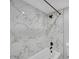 Modern bathroom with marble-look tile, black fixtures, and a bathtub at 218 Forkner Dr # D, Decatur, GA 30030