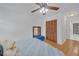 Bedroom with light walls, ceiling fan, and closet at 218 Forkner Dr # D, Decatur, GA 30030