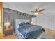 A stylish bedroom features a black accent wall, ceiling fan, and spacious layout at 218 Forkner Dr # D, Decatur, GA 30030