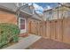 Welcoming entryway with a classic front door, a covered porch, and a wooden fence for added privacy at 218 Forkner Dr # D, Decatur, GA 30030