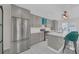 Well-equipped kitchen with stainless steel appliances, gray cabinetry, and a center island with counter seating at 218 Forkner Dr # D, Decatur, GA 30030