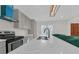 Modern kitchen featuring a center island, stainless steel appliances, and a unique blue range hood at 218 Forkner Dr # D, Decatur, GA 30030