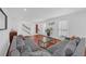 Open-concept living room with hardwood floors, grey couches, and a view of the staircase at 218 Forkner Dr # D, Decatur, GA 30030