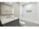 Modern bathroom with white subway tiles and quartz vanity at 458 Holly Nw St, Atlanta, GA 30318