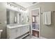 Bathroom boasts double vanity, marble shower, and elegant fixtures at 458 Holly Nw St, Atlanta, GA 30318