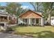 Charming craftsman bungalow with white brick, wood accents, and a manicured lawn at 458 Holly Nw St, Atlanta, GA 30318