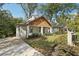Updated craftsman home with white brick exterior, wood accents, and a spacious yard at 458 Holly Nw St, Atlanta, GA 30318
