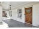 Inviting front porch with a wood door and tiled flooring at 458 Holly Nw St, Atlanta, GA 30318