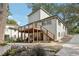 Back exterior showcasing deck and landscaping at 458 Holly Nw St, Atlanta, GA 30318