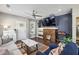 Modern living room with hardwood floors, a fireplace, and ample natural light at 458 Holly Nw St, Atlanta, GA 30318