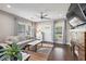 Bright living room with hardwood floors, a fireplace, and a large window at 458 Holly Nw St, Atlanta, GA 30318