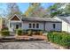 Charming gray brick ranch house with a stone walkway and landscaped front yard at 478 Pensdale Rd, Decatur, GA 30030