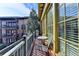 Sunny outdoor balcony with a table, chairs, and views of the surrounding community at 5890 Bond St, Cumming, GA 30040