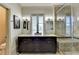 Bathroom featuring double vanity with granite counters and tiled glass enclosed shower and private commode at 5890 Bond St, Cumming, GA 30040