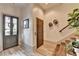 Elegant foyer with plank walls, attractive flooring, a staircase, and stylish decor at 5890 Bond St, Cumming, GA 30040