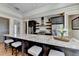 Kitchen island with granite countertops, stainless steel appliances, and seating for four people at 5890 Bond St, Cumming, GA 30040