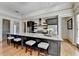 Kitchen island with granite countertops, stainless steel appliances, and seating for four people at 5890 Bond St, Cumming, GA 30040