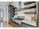 This kitchen features a stainless steel gas range, granite countertops, and wooden cabinets at 5890 Bond St, Cumming, GA 30040
