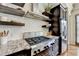 This kitchen features granite countertops, stainless steel appliances, and white subway tile at 5890 Bond St, Cumming, GA 30040