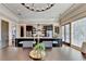 Modern kitchen with a large island, granite countertops, stainless steel appliances, and seating for four at 5890 Bond St, Cumming, GA 30040