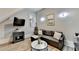 Living Room featuring gray sofa, dark side table, and marble coffee table at 5890 Bond St, Cumming, GA 30040