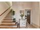 Beautiful staircase with wood treads and plank walls plus an attractive entry door at 5890 Bond St, Cumming, GA 30040
