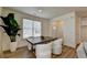 Dining area with a wood table, white chairs, and large plant at 1591 Salem Dr # 76, Conyers, GA 30013