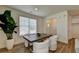 Dining area with a wood table, white chairs, and large plant at 1591 Salem Dr # 76, Conyers, GA 30013