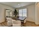 Dining area with a wood table, white chairs, and large plant at 1591 Salem Dr # 76, Conyers, GA 30013