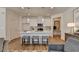 Modern kitchen island with seating and white shaker cabinets at 1591 Salem Dr # 76, Conyers, GA 30013