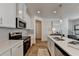 Clean kitchen with white cabinets, herringbone backsplash and stainless steel appliances at 1591 Salem Dr # 76, Conyers, GA 30013