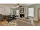 Bright living room with fireplace, hardwood floors, and comfortable seating at 1591 Salem Dr # 76, Conyers, GA 30013