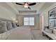 Spacious main bedroom with a king-size bed and ceiling fan at 1591 Salem Dr # 76, Conyers, GA 30013