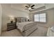 Spacious main bedroom with a king-size bed and ceiling fan at 1591 Salem Dr # 76, Conyers, GA 30013