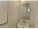 Small powder room with a pedestal sink and mirror at 1591 Salem Dr # 76, Conyers, GA 30013