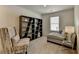 Cozy sitting room with a chaise lounge, shelving, and window at 1591 Salem Dr # 76, Conyers, GA 30013