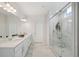 Elegant bathroom with double vanity, large shower, and marble tile at 4130 Grandview Vista St, Cumming, GA 30028