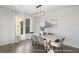 Modern dining room with gray chairs, white table and large windows at 4130 Grandview Vista St, Cumming, GA 30028