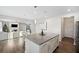 Kitchen island with granite countertop, looking into living room at 4130 Grandview Vista St, Cumming, GA 30028