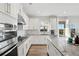 Modern kitchen with stainless steel appliances and granite countertops at 4130 Grandview Vista St, Cumming, GA 30028