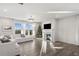 Bright living room with sectional sofa, fireplace, and hardwood floors at 4130 Grandview Vista St, Cumming, GA 30028