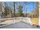 Private deck overlooking wooded backyard with steps to the ground at 5224 Martins Crossing Rd, Stone Mountain, GA 30088