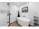 Spa-like bathroom with soaking tub and walk-in shower at 9585 Hutcheson Ferry Rd, Palmetto, GA 30268